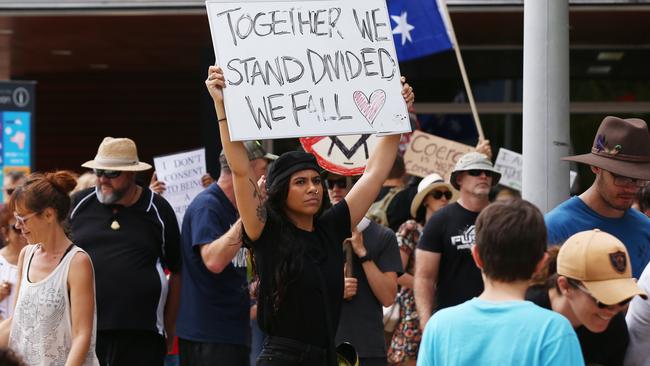 Janelle Raumati of Smithfield carries a message at the march. Picture: Brendan Radke