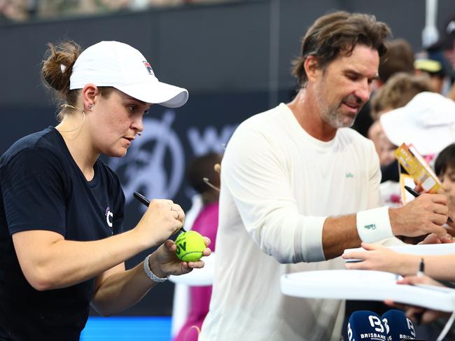 BRISBANE, AUSTRALIA - DECEMBER 29: Ashleigh Barty and Patrick Rafter with fans after an exhibition match during day one of the 2025 Brisbane International at Pat Rafter Arena on December 29, 2024 in Brisbane, Australia. (Photo by Chris Hyde/Getty Images)