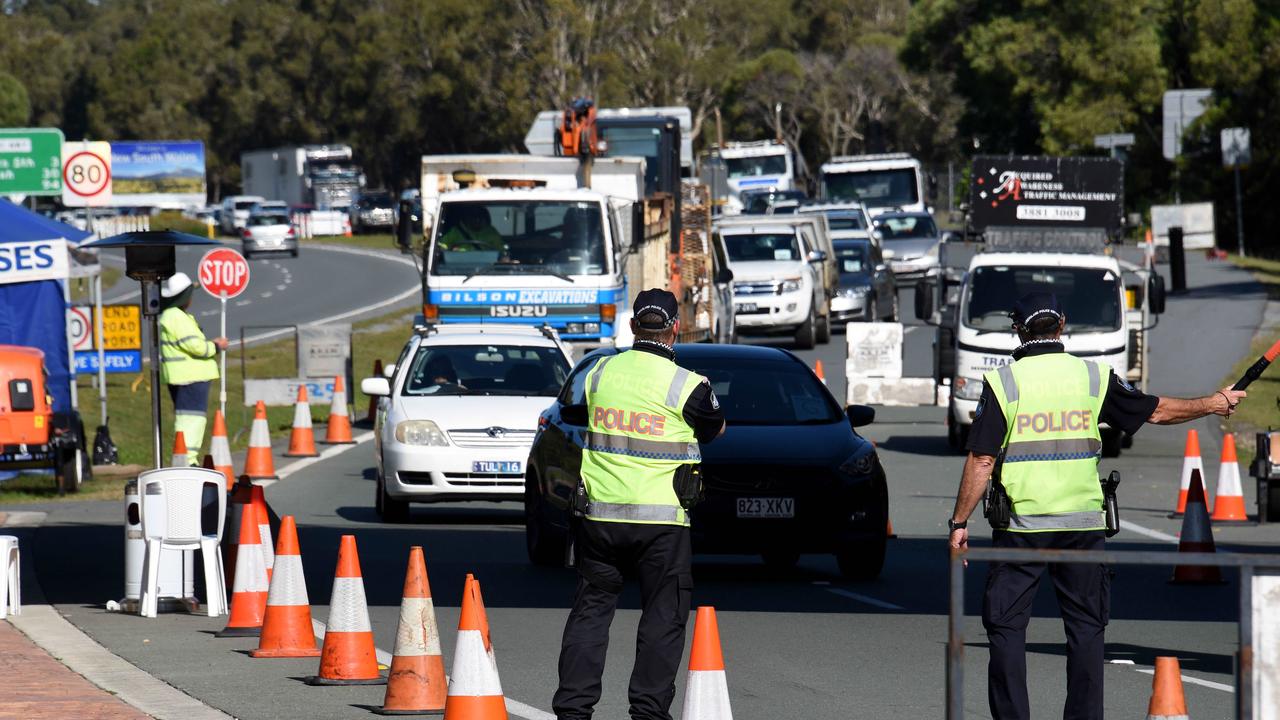 Police check cars at the Queensland border with NSW. Picture: Steve Holland/NCA Newswire