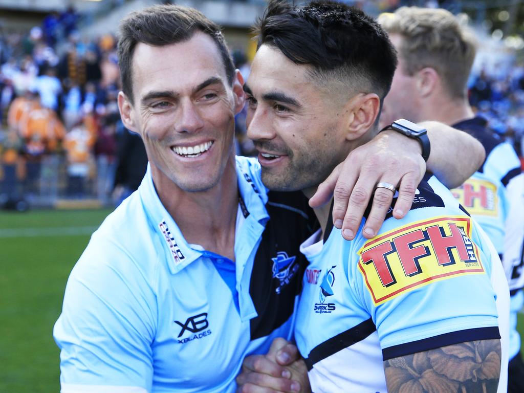 John Morris hugs Shaun Johnson. AAP.