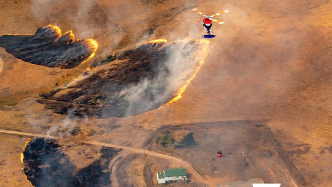 A fire is alarmingly close to a home. Picture: Air Attack/ Victorian State Government