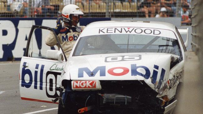 Peter Brock exits his new VP Commodore after clipping a kerb and hitting a wall in 1992.