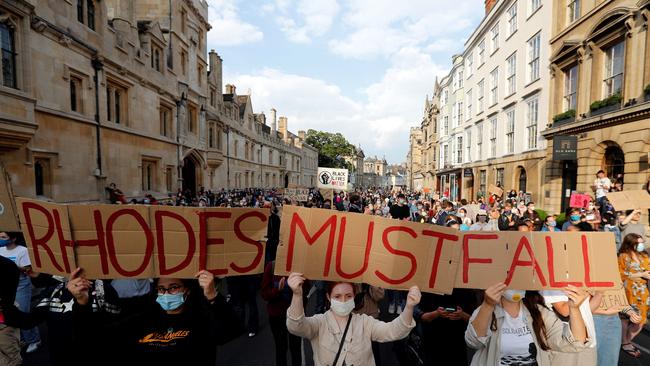 Demonstrators hold placards during a protest arranged by the 'Rhodes Must Fall' campaign, calling for the removal of a statue of British businessman and imperialist Cecil John Rhodes, from outside Oriel College at the University of Oxford. Picture: AFP