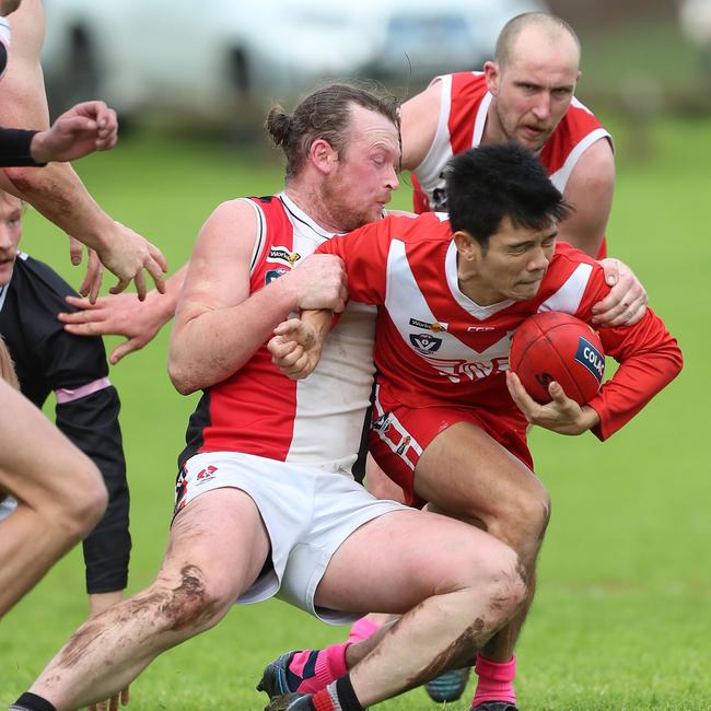 Birregurra’s Jason Rowan applies a strong tackle on Alvie’s Andrich de la Cruz.