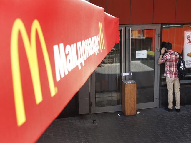 epa04362318 A man looks through the window at the entrance of a closed branch of McDonald's in Moscow, Russia, 21 August 2014. Russia's consumer watchdog ordered four McDonald's restaurants in Moscow to be temporarily closed, alleging that the US fast food chain had violated sanitary rules. The news raised fears of a fresh round of sanctions against Western businesses. Earlier this month, Moscow banned food imports from a number of countries in retaliation against sanctions imposed on Russia over the crisis in Ukraine. EPA/MAXIM SHIPENKOV