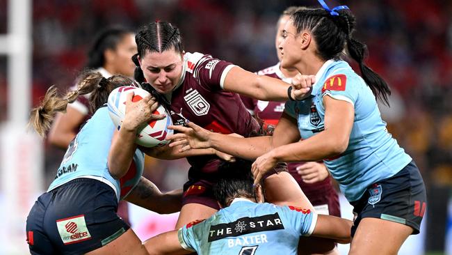 BRISBANE, AUSTRALIA - MAY 16: Romy Teitzel of Queensland takes on the defence during game one of the 2024 Women's State of Origin series between Queensland and New South Wales at Suncorp Stadium on May 16, 2024 in Brisbane, Australia. (Photo by Bradley Kanaris/Getty Images)