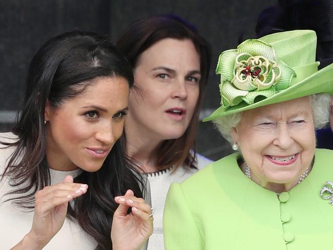 Queen Elizabeth II and the Duchess of Sussex and in the background Samantha Cohen, the Queen's former Assistant Private Secretary who also worked with the Duchess. Picture: Getty Images