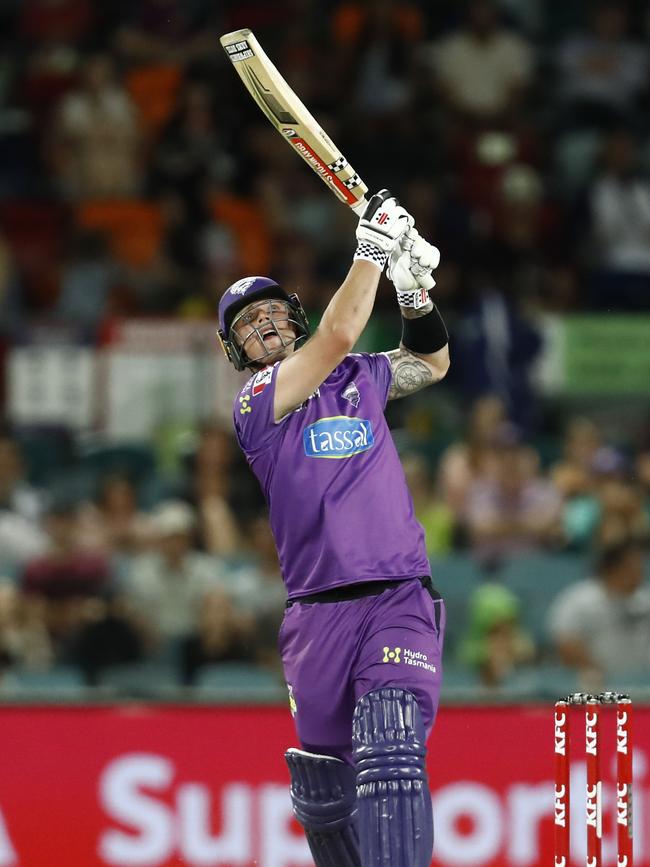 Ben McDermott launches a six into the stands during the Big Bash League match between the Sydney Thunder and the Hobart Hurricanes at Manuka Oval, on January 18, 2021, in Canberra, Australia. (Photo by Darrian Traynor/Getty Images)