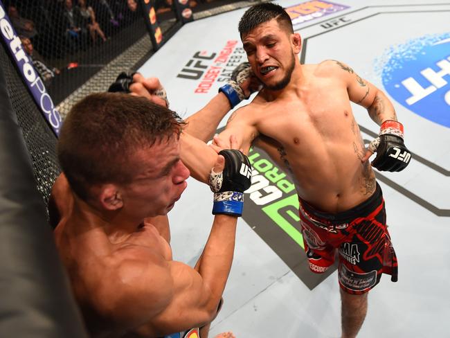 Efrain Escudero punches Rodrigo de Lima in their lightweight fight during the UFC Fight Night event on February 14, 2015 in Broomfield, Colorado. (Photo by Josh Hedges/Zuffa LLC/Zuffa LLC via Getty Images)