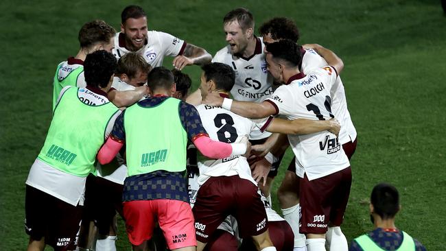 SYDNEY, AUSTRALIA - JANUARY 06: Luka Jovanovic of Adelaide United celebrates with team mates after scoring a goal during the round 12 A-League Men match between Macarthur FC and Adelaide United at Campbelltown Stadium on January 06, 2025, in Sydney, Australia. (Photo by Matt Blyth/Getty Images)