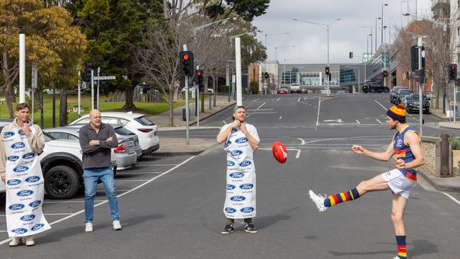 They recreated the incident outside the club’s Mad Monday celebrations with the help of goal umpire Billy Brownless. Picture: Jason Edwards