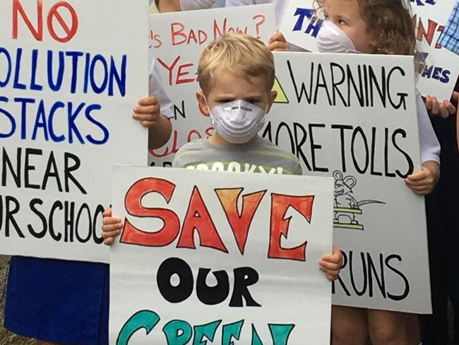 Schoolchildren and parents stage a dust mask protest, outside Balgowlah Boys High School, against the Beaches Link tunnel proposal.