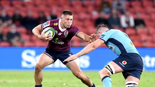 BRISBANE, AUSTRALIA - JULY 03: James O'Connor of the Reds attempts to break away from the defence during the round 1 Super Rugby AU match between the Queensland Reds and the New South Wales Waratahs at Suncorp Stadium on July 03, 2020 in Brisbane, Australia. (Photo by Bradley Kanaris/Getty Images)