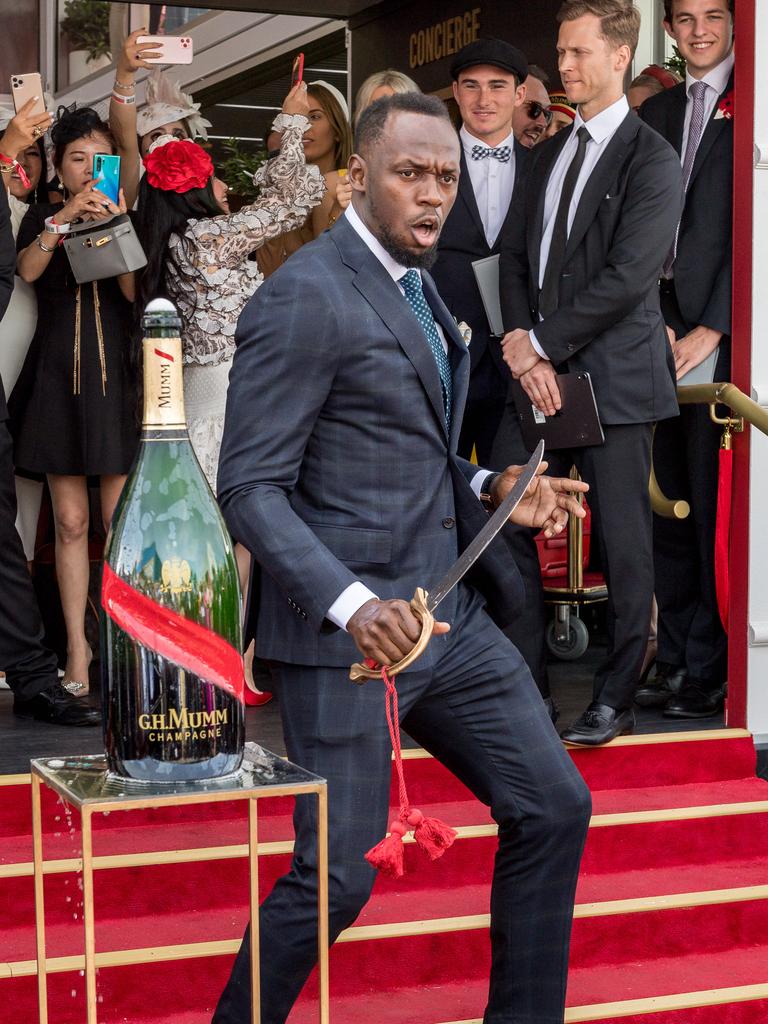 Usain Bolt performs the Mumm tap tap challenge. Picture: Jake Nowakowski