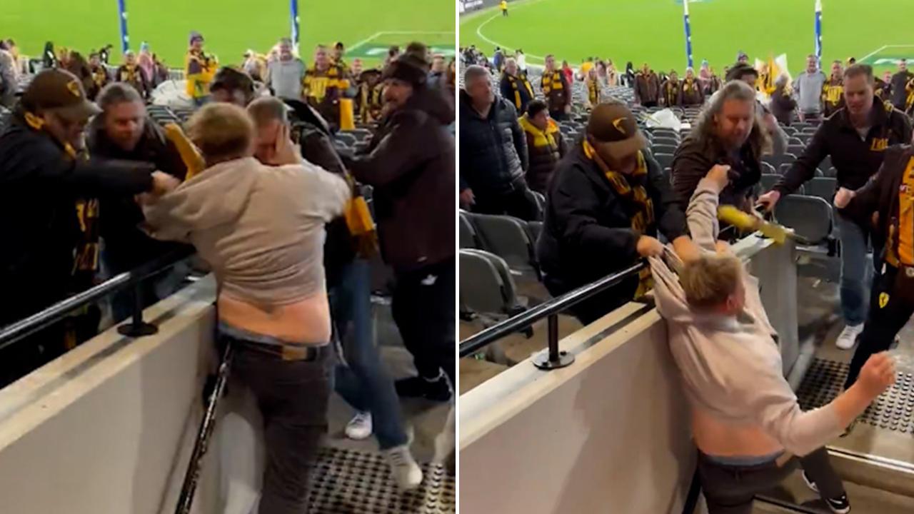 Kicks fly, punches thrown in ugly footy fan brawl at MCG