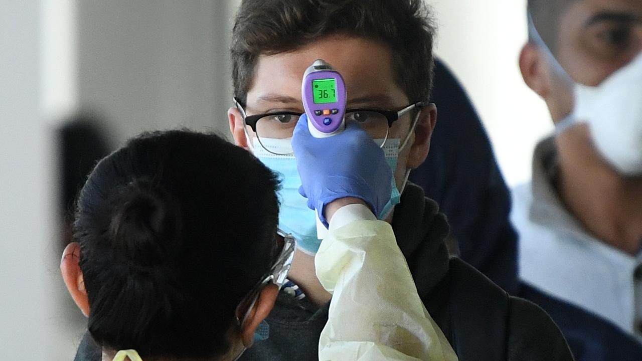 Travellers being temperature checked at Sydney Airport in August. Picture: NCA NewsWire/Joel Carrett