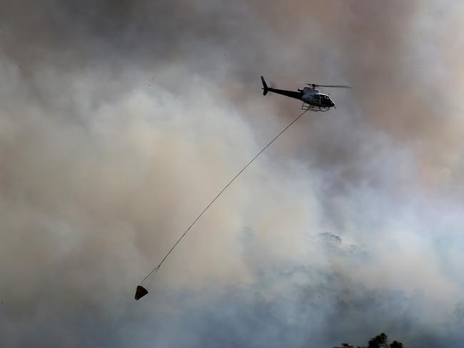 Water bombing aircraft attack the fire front. Picture: Toby Zerna