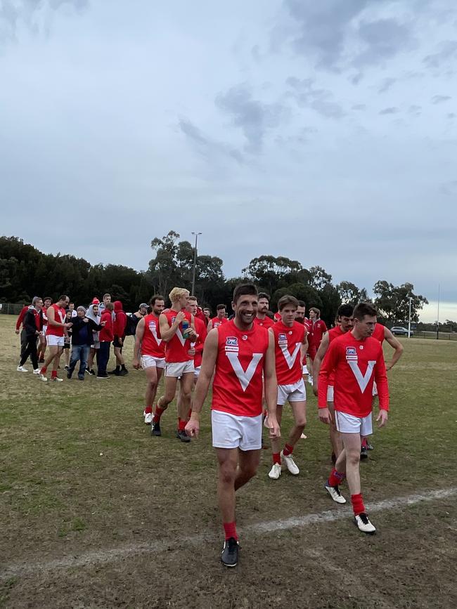 East Brighton players walk off victorious.