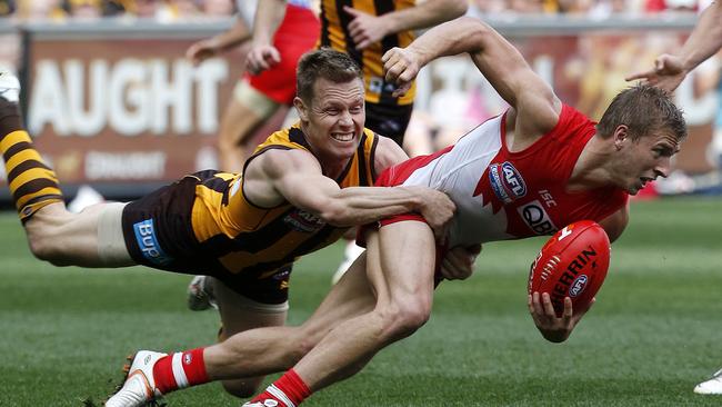 Mitchell bringing down Kieren Jack during the 2014 Grand Final. Picture: David Caird