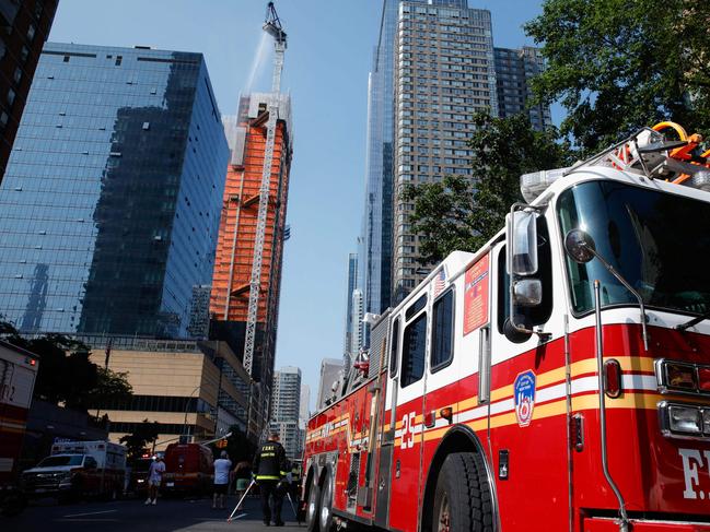 Firefighters at the scene. The incident happened during morning rush hour. Picture: AFP