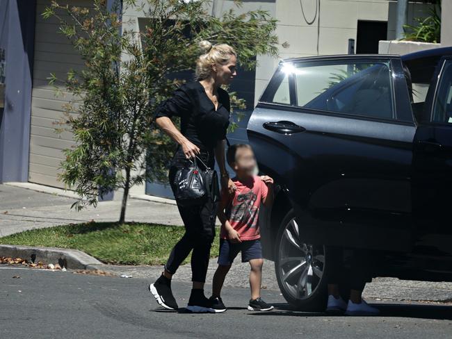 Viktoria Karida and her son outside John Macris's parents home in Mosman. Photographer: Adam Yip