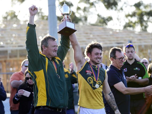 Marion Rams coach Ben Porter and captain Stephen Saunders with the premiership cup. Picture: AAP/Bianca De Marchi