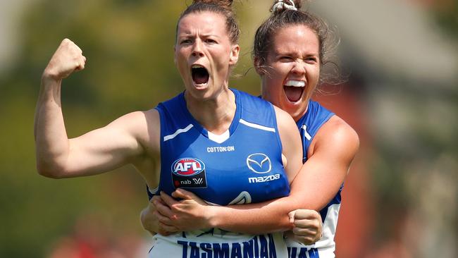 Brittany Gibson of the Kangaroos, left, celebrates a goal with team-mate Emma Kearney during the AFLW Round 1 match with the Carlton Blues at North Hobart Oval today. Picture: ADAM TRAFFORD/AFL MEDIA/GETTY IMAGES