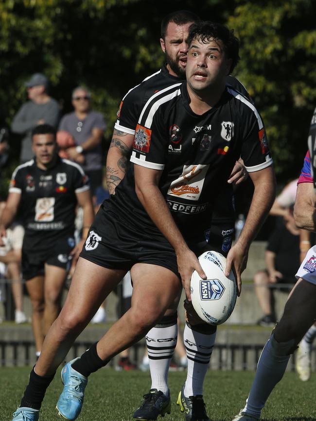 Redfern's Djawinj Gordon with the ball. Picture: John Appleyard