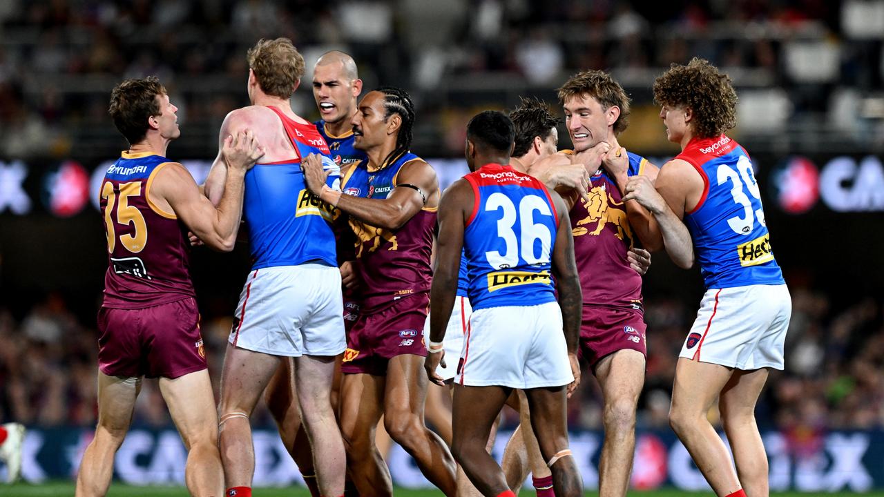 BRISBANE, AUSTRALIA - JUNE 28: Players show their frustrations during the round 16 AFL match between Brisbane Lions and Melbourne Demons at The Gabba, on June 28, 2024, in Brisbane, Australia. (Photo by Bradley Kanaris/Getty Images)