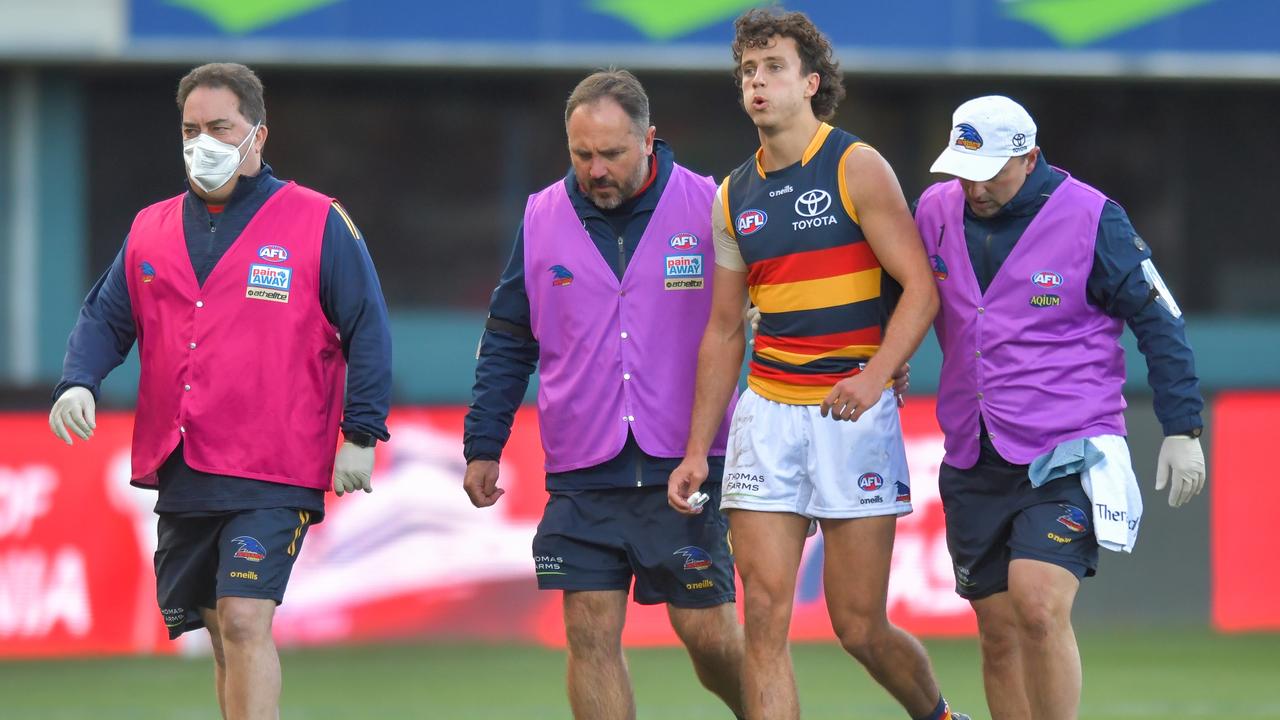 HOBART, AUSTRALIA - JUNE 26: Will Hamill of the Crows leaves the field with concussion during the round 15 AFL match between the North Melbourne Kangaroos and the Adelaide Crows at Blundstone Arena on June 26, 2022 in Hobart, Australia. (Photo by Simon Sturzaker/AFL Photos via Getty Images)