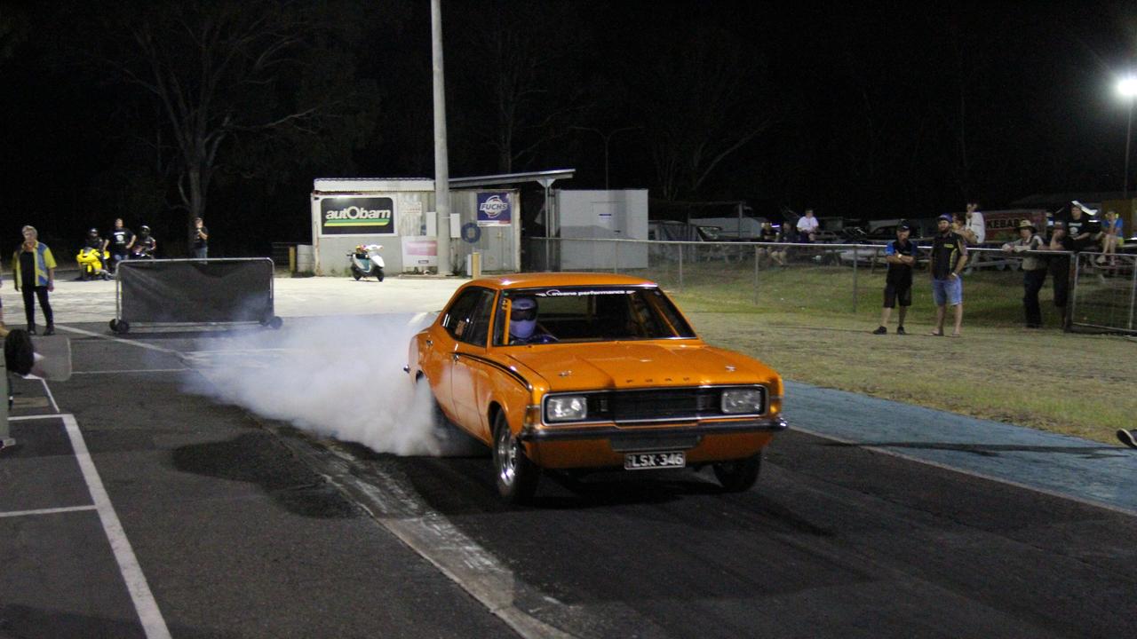 Todd Marshall warms up the tyres in his twin-turbo LS powered Cortina before cutting a personal best quarter mile time of 8.7 seconds at 156m/h on the Benaraby dragway strip. Picture: Rodney Stevens