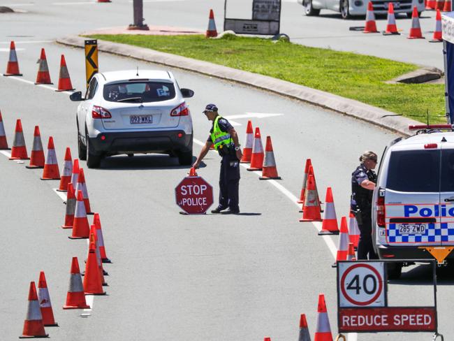 Police at the Queensland border on the Gold Coast Highway. Picture: Nigel Hallett