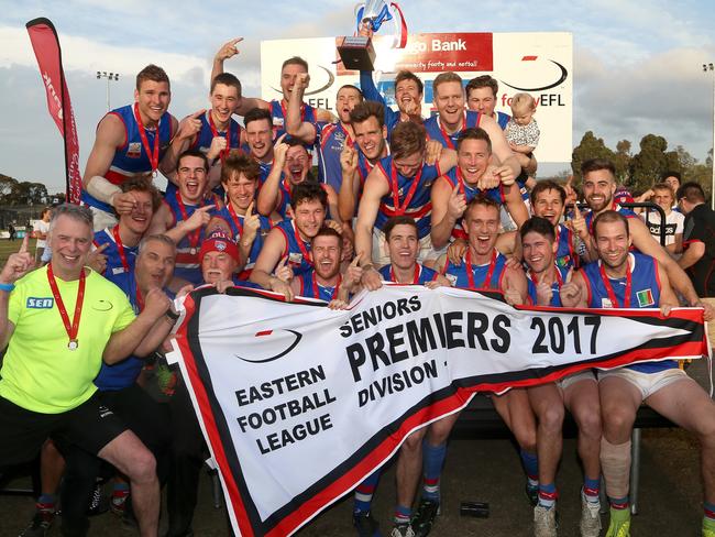 Frank Anderson (front row, fourth from right) in a premiership pose. Picture: Hamish Blair