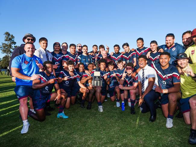 Ipswich SHS players with the trophy. Picture: NIGEL HALLETT