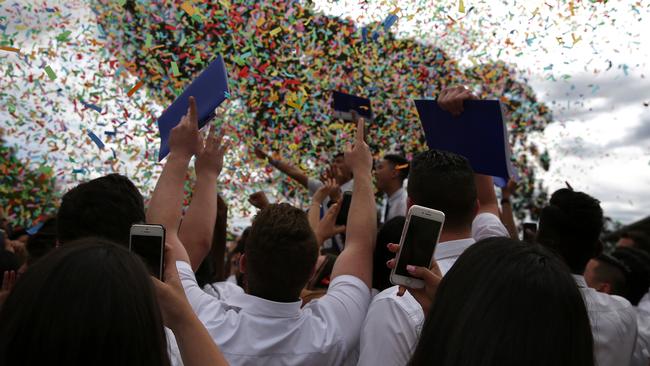 Confetti time for the students and their cameras.