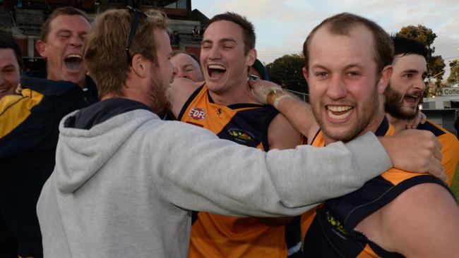 Dale May (right) celebrates Strathmore’s 2014 premiership triumph. Pictures:Angie Basdekis