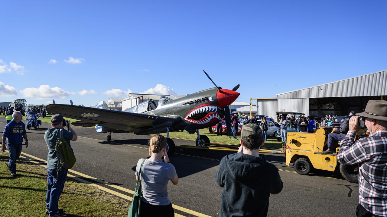 A P40 Kittyhawk WWII American aircraft that lent air support to the 25th Battalion at Milne Bay is moved to a hanger for display at the David Hack Classic, Sunday, May 18, 2025. Picture: Kevin Farmer