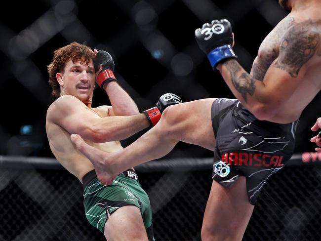 DAILY TELEGRAPH - 10.9.23MUST NOT PUBLISH BEFORE CLEARING WITH TELEGRAPH PIC EDITOR -UFC 293 at Qudos Bank Arena in Homebush, Sydney.  Jack Jenkins (green trunks) loses to Chepe Marshal after dislocating his elbow. Picture: Sam Ruttyn