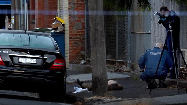 Mr Acquaro’s body on an Brunswick East footpath. Picture: Nicole Garmston