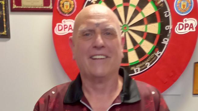 Mackay Darts Club President Kevin Brown with his set-up at home. Mr Brown fell in love with darts growing up in England. Picture: Contributed.