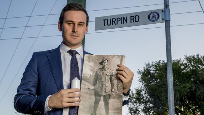 Sam O’Connor holding a photograph of Sydney Henry Turpin provided from the Australian War Memorial. Picture: Jerad Williams