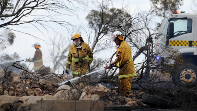 The flames headed southeast towards Whitwarta, Bowmans and Balaklava. CFS volunteers John Fitzgerald and Denis Story are pictured mopping up hot spots near Whitwarta.