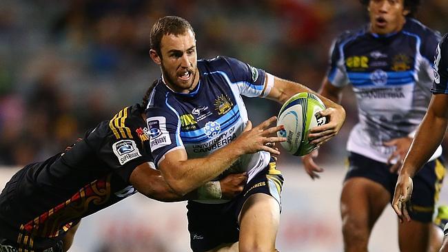 CANBERRA, AUSTRALIA - APRIL 25: Nic White of the Brumbies runs the ball during the round 11 Super Rugby match between the Brumbies and the Chiefs at Canberra Stadium on April 25, 2014 in Canberra, Australia. (Photo by Mark Nolan/Getty Images)