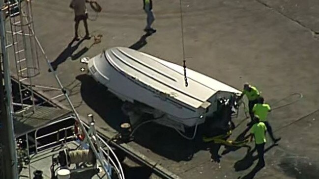 The boat is winched back onto the wharf at Port Lincoln on Tuesday. Picture: 7NEWS