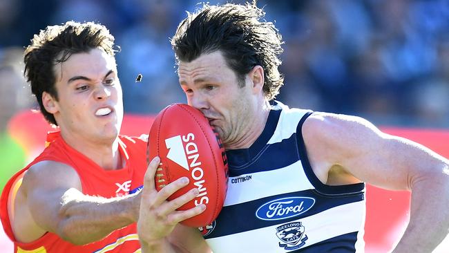 Patrick Dangerfield of the Cats (right) is chasing his first AFL premiership.