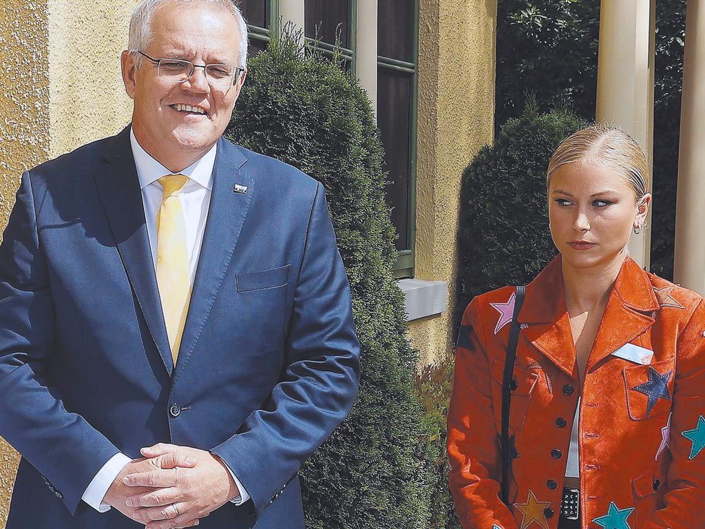 Former Prime Minister Scott Morrison and with Grace Tame, who appeared to be uncomfortable with the meeting. Picture: NCA NewsWire / Gary Ramage Picture: NCA NewsWire / Gary Ramage,