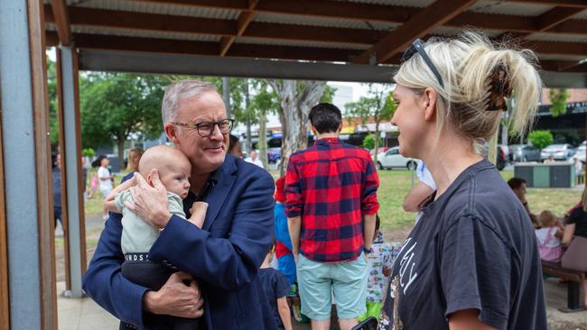 The PM held babies and played with people’s pets at the Macleod Village Green Playground in Melbourne’s north. Picture: NCA NewsWire / Valeriu Campan