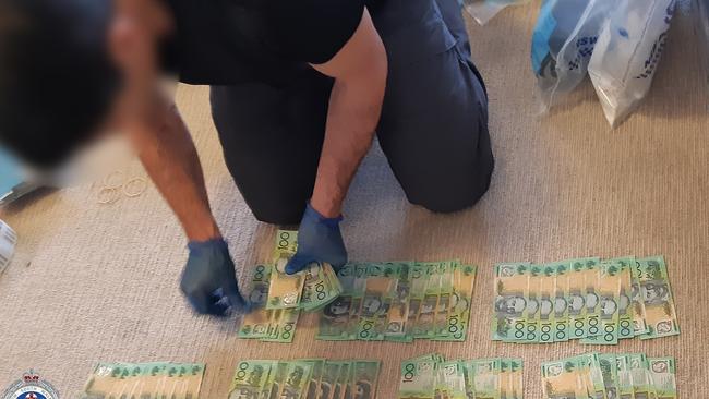 Police found $46,000 and a money counting machine in a Little Bay home.