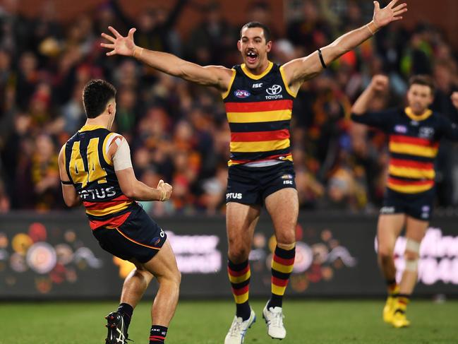 ADELAIDE, AUSTRALIA - JUNE 08: Lachlan Murphy of the Adelaide Crows celebrates a goal with Taylor Walker of the Adelaide Crows during the round 12 AFL match between the Adelaide Crows and the Greater Western Sydney Giants at Adelaide Oval on June 08, 2019 in Adelaide, Australia. (Photo by Mark Brake/Getty Images)