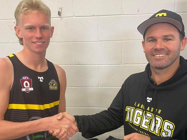 A young Luke Coombes being presented his guernsey by Todd Featherstone. Picture: Supplied.